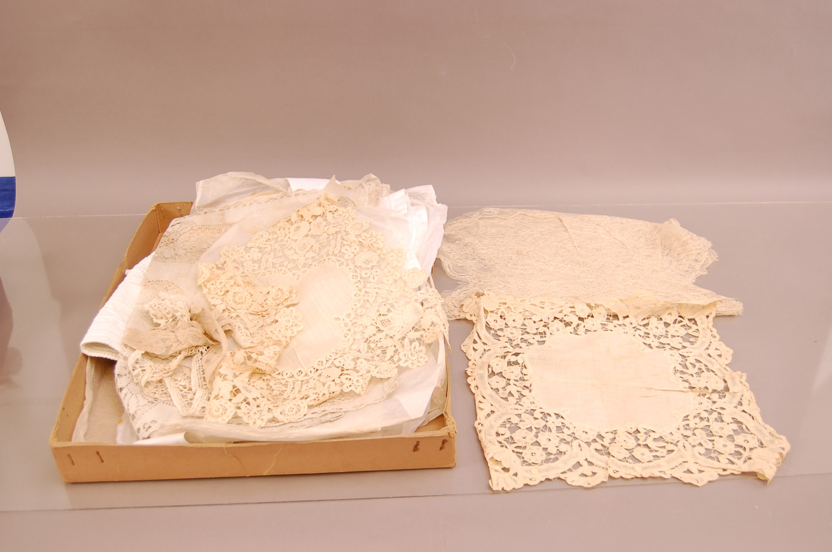 A large collection of late 19th/early 20th century textiles, including, laces, a ladies bonnet and