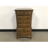 A small 20th century mahogany chest on chest, AF, 77cm high by 42cm wide and 30cm deep