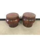 A pair of mid 20th century Asian wooden barrel stools, 43cm high, with circular seat tops (4)