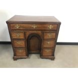 A George III oak and walnut kneehole desk, 85cm wide