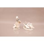 Two Lladro porcelain groups, one with lady and ducks, E-13 J, 23cm high, together with a group of