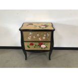 A modern Chinese chest of drawers, 65cm wide and 80cm high, some damages, with gold leaf and painted