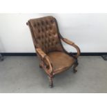 A vintage leather buttoned chair