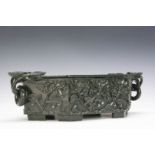 A 20th century two handled nephrite jade planter, of hexagonal shape, carved foliate decoration, two
