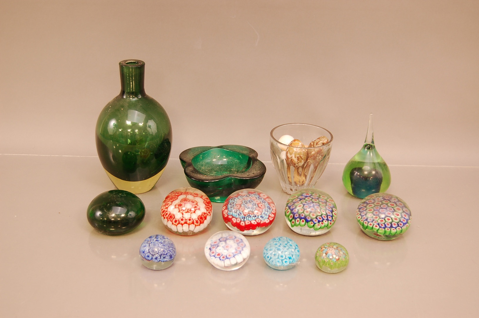 A group of glassware and glass paperweights, to include a coloured glass vase, ashtray, millefiori