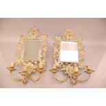 A pair of Victorian brass mirrored three branch wall sconces, 38cm high, together with a pair of mid