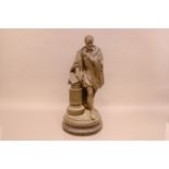 A cast spelter figure of a 16th century man, possibly the poet Torquato Tasso, 52cm high, leaning on