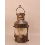 An early 20th century nautical lamp, 42cm high, by W.T. George & Co. Birmingham