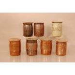 Seven stoneware studio pottery jars with lids, by Henry Stringer, all approximately 14cm high