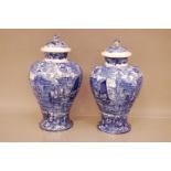 A pair of late 19th century Wedgwood pottery Ferrara pattern vases, one cracked, both with damaged