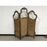 A late 19th century French gilt three panel screen, AF, 166cm high and middle panel 47cm wide,