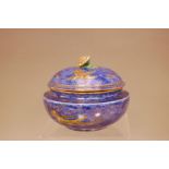 A mid 20th century Wedgwood pottery lustre ware pot and cover, 15cm diameter, blue exterior with