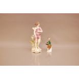 A late 19th century Meissen figure of a hunter, AF, holding rifle, damaged, and pair of birds,