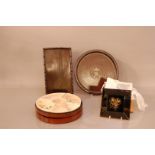 A selection of Oriental items, comprising two hardwood trays one circular with a jade central
