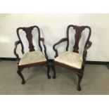 A pair of Victorian Queen Anne style mahogany carver dining chairs, with drop in seats
