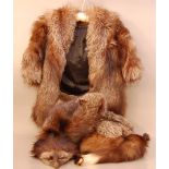 A collection of fur items, comprising a silver fox coat and shawl, together with two other fur