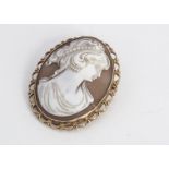 A contemporary 9ct gold and shell cameo brooch, oval shape with carved profile of a young women,