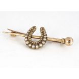 An George V yellow metal and seed pearl horseshoe bar brooch, 4.2 cm long, 4.9g