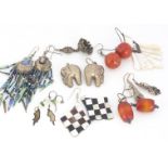 A collection of silver, coral, mother of pearl earrings, including chequer boards, drops, beads etc