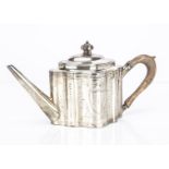 A George III silver teapot by Hester Bateman, 30.5cm long and 14.8 ozt, repaired to base, the shaped