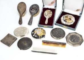 A group of Art Deco period compacts and other vanity items, including a Japanese small hand mirror