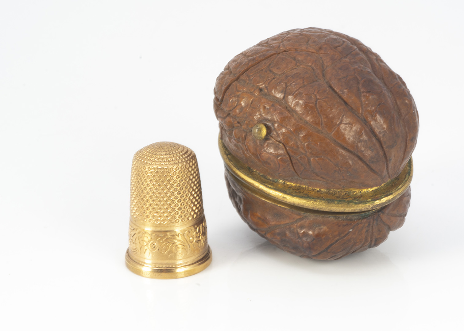 A 19th century walnut thimble case, AF, containing gilt thimble in fitted interior, cracked and - Image 2 of 3