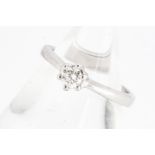 A platinum diamond solitaire ring, the brilliant cut in six claw setting, on a hallmarked shank,