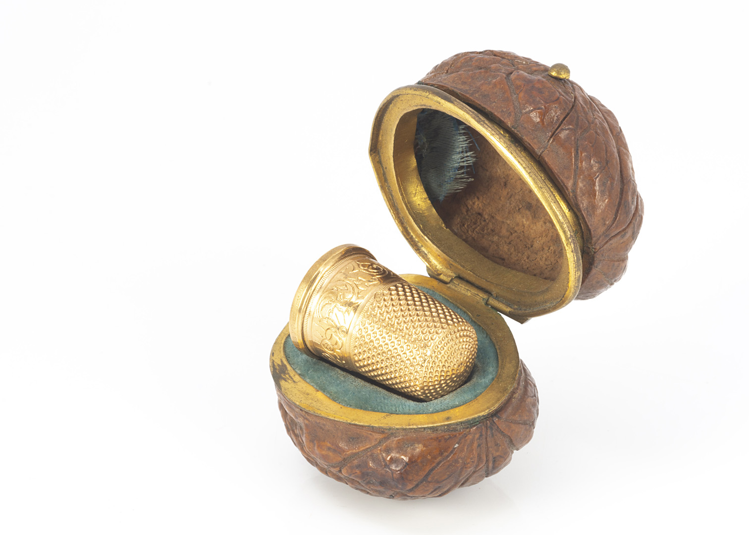 A 19th century walnut thimble case, AF, containing gilt thimble in fitted interior, cracked and