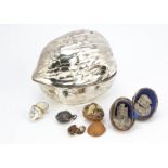 A large modern silver plated walnut and contents, the 14cm box in two halves and containing a