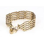 A 9ct gold gate link and padlock clasped bracelet, five bars with linked and tapered end section,