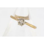 A diamond 18ct gold solitaire, the illusion set eight cut, on 18ct gold shank, ring size M, 2g