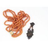 A 19th century four strand coral and gilt metal necklace, with tongue and engraved box clasp,