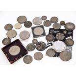A small collection of coins, including a 2008 Silver Bullion Britannia £2 coin, a worn and drilled