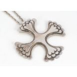A contemporary silver cross pendant, of stylised Maltese shape with stepped design, Sheffield