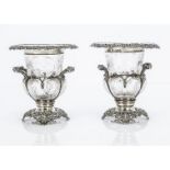 A pair of Edwardian silver and glass urn vases by William Comyns, 13cm high, London 1901 and 1902,