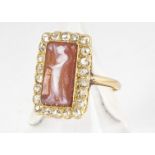 A continental yellow metal marked 18ct marked carved glass cameo and diamond dress ring, of
