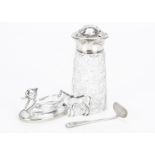 An Art Deco period cut glass and silver sugar sifter, together with a silver baby feeding slide, a