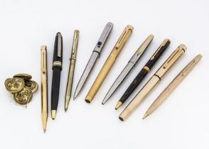 A group of seven pens, including a pair of gold plated Sheaffer fountain pens and a biro, three