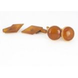 Two pairs of amber cufflinks, diamond shaped chain linked examples and other with gilt metal, 10g (