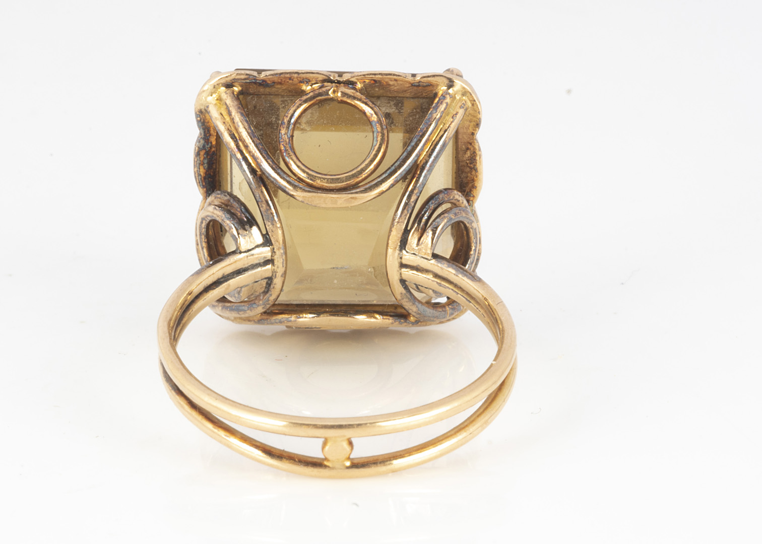 A citrine and gold dress ring, the mixed square cut, in a claw setting on a pierced basket, on a - Image 2 of 3
