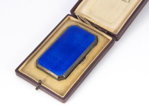 An Art Deco silver and blue enamel small cigarette case, presented in a fitted The Siberian