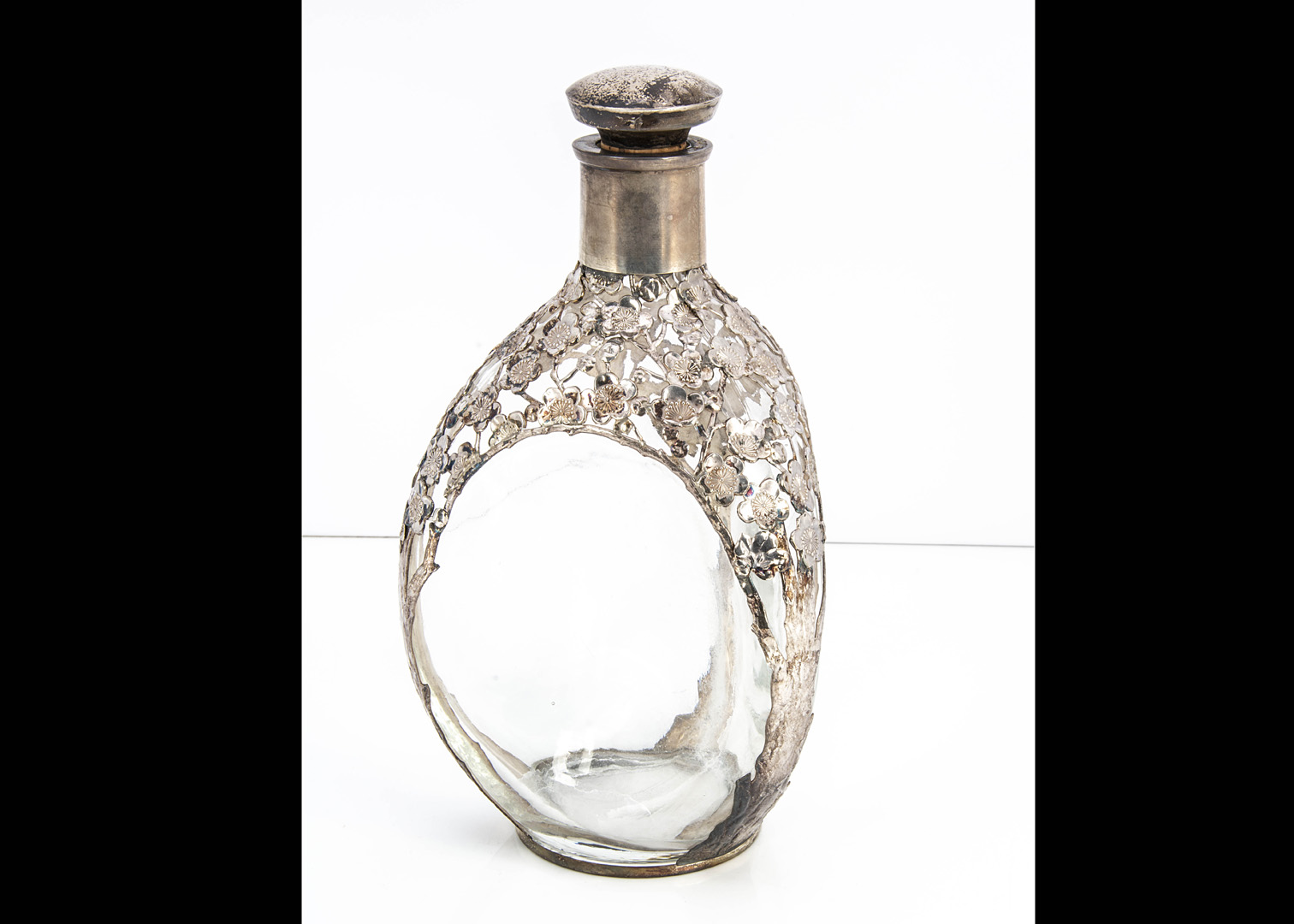 A mid 20th century white metal mounted Haig whisky bottle, marked Sterling, with stopper