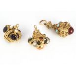 Three continental yellow metal gem set fobs, comprising a garnet and pearl example, (pearl missing