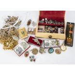 A collection of costume jewels, including a collection of gilt metal chains, a pair of Siam enamel