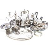 A collection of silver plate, including a glass claret jug, a candelabra, and more