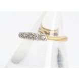 An 18ct yellow gold and platinum set five stone diamond ring, eight cut diamonds in rubbed over