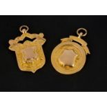Two early 20th century 9ct gold medallion fobs, of shield and circular shape, 26g