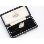 An Art Deco period platinum and diamond lady's cocktail dress watch, 14mm wide and by 27mm high,