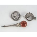 Three items of Celtic silver jewellery, including an Irish hallmarked plaid brooch, a Scottish