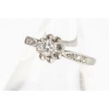 A white metal diamond solitaire ring, the claw set stone in crimped setting, diamond 0.30cts approx,